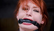 Violet Monroe drools around leather bit gag