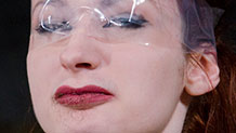Violet Monroe face covered with tape blindfold