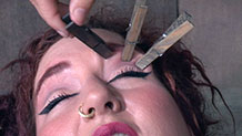 Decoration model has clothespins pulled off eyebrows