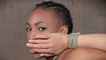 Nikki Darling with Milcah Halili's finger in mouth