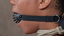 Nikki Darling in neck rope and ball gag